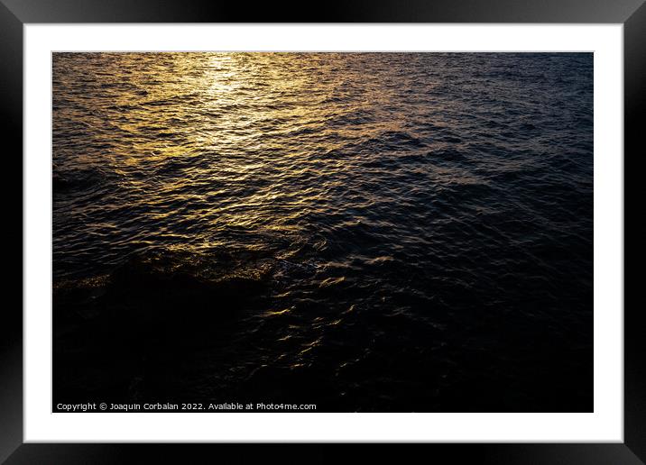 Background for natural designs, the sunset sun reflects on the s Framed Mounted Print by Joaquin Corbalan