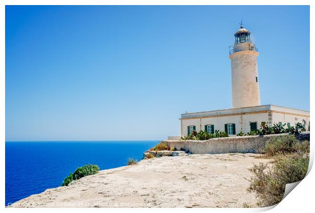 Formentera's lighthouse next to the sea cliff illuminates the co Print by Joaquin Corbalan