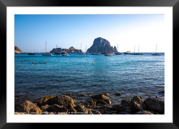 Several yachts and boats anchored near the coast relax watching  Framed Mounted Print by Joaquin Corbalan