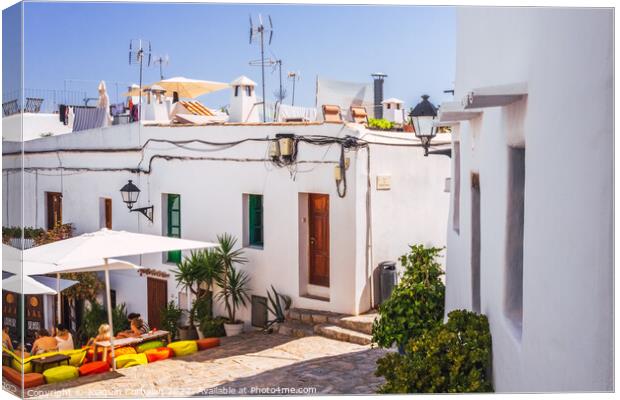Traditional Ibizan houses, with whitewashed walls to combat the  Canvas Print by Joaquin Corbalan