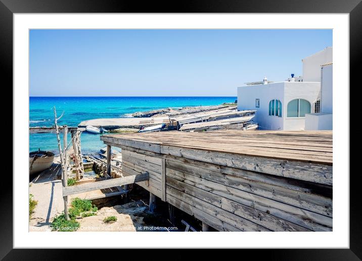 Traditional rustic pier with wooden boards in a cove in Formente Framed Mounted Print by Joaquin Corbalan