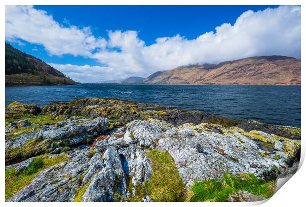 A rocky island in the middle of a body of water Print by Bill Allsopp