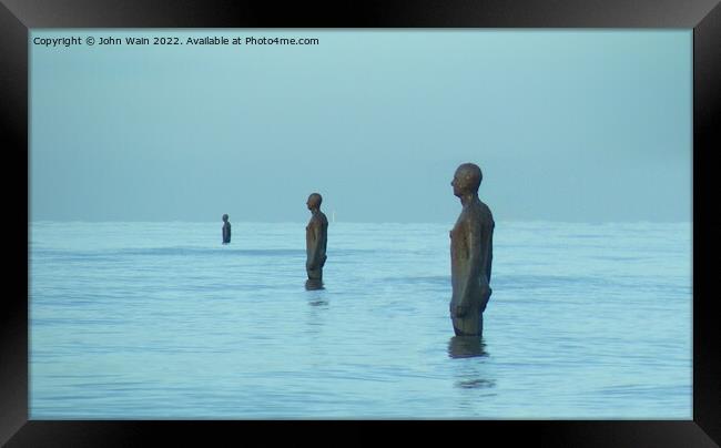 Three Men on the beach Framed Print by John Wain
