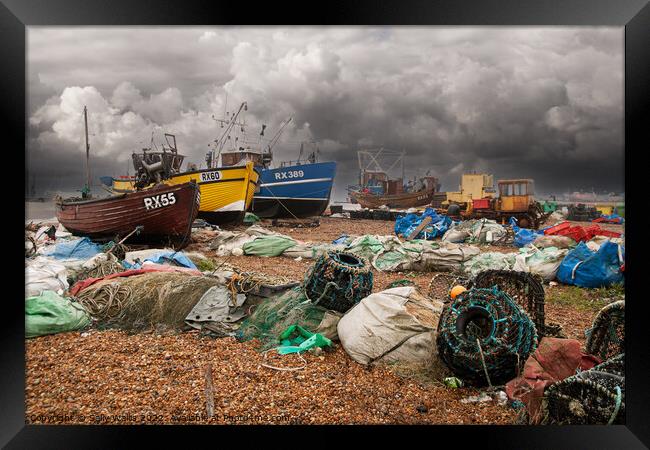 Fishing Boats and Nets on Hastings Beach Framed Print by Sally Wallis