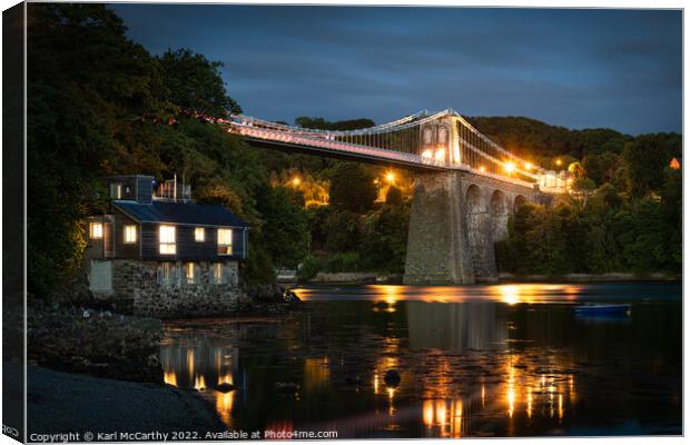 Menai Bridge glowing in the straits Canvas Print by Karl McCarthy