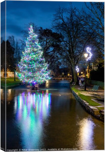The Christmas Tree In The River At Bourton-on-the-Water Canvas Print by Peter Greenway