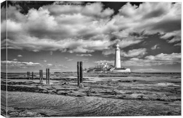 St Marys lighthouse and jetty posts monochrome Canvas Print by Graham Moore