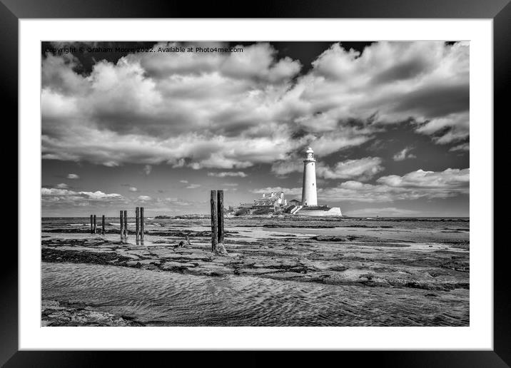 St Marys lighthouse and jetty posts monochrome Framed Mounted Print by Graham Moore