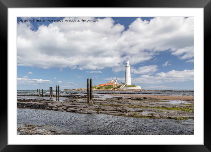 St Marys lighthouse and jetty posts Framed Mounted Print by Graham Moore