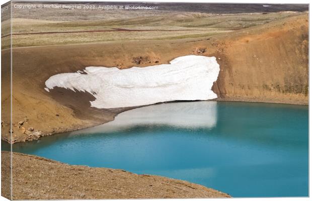 The crystal clear deep blue lake Krafla on Iceland. Canvas Print by Michael Piepgras