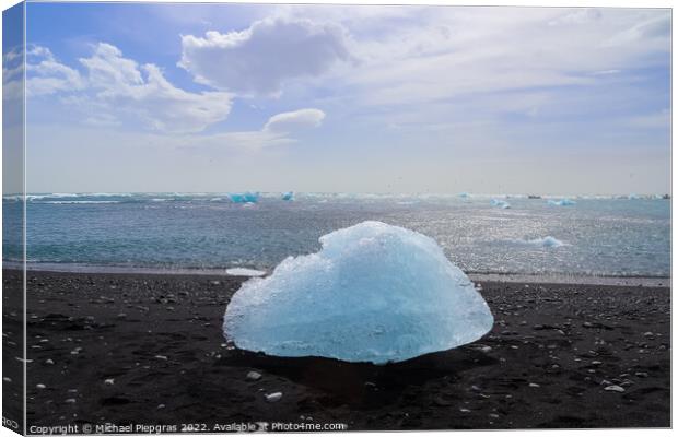 Diamond Beach in Iceland with blue icebergs melting on black san Canvas Print by Michael Piepgras