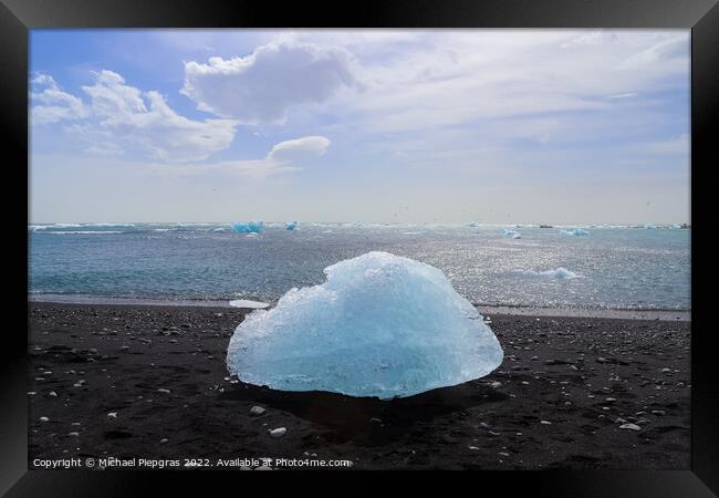 Diamond Beach in Iceland with blue icebergs melting on black san Framed Print by Michael Piepgras