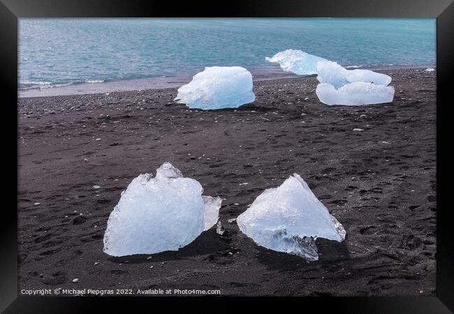 Diamond Beach in Iceland with blue icebergs melting on black san Framed Print by Michael Piepgras
