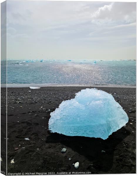 Diamond Beach in Iceland with blue icebergs melting on black san Canvas Print by Michael Piepgras