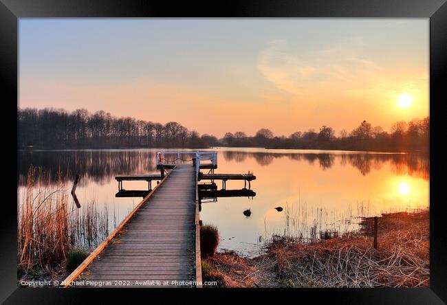 Beautiful and romantic sunset at a lake in yellow and orange col Framed Print by Michael Piepgras