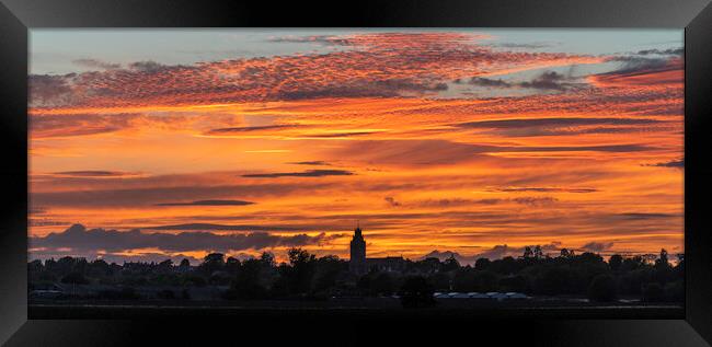 Sunset behind St Andrew's church, Sutton-in-the-Isle, Cambridges Framed Print by Andrew Sharpe