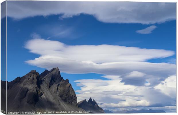 Spectacular UFO clouds in the sky over Iceland - Altocumulus Len Canvas Print by Michael Piepgras