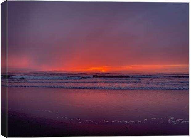 A foggy beach sunset Canvas Print by Sam Norris