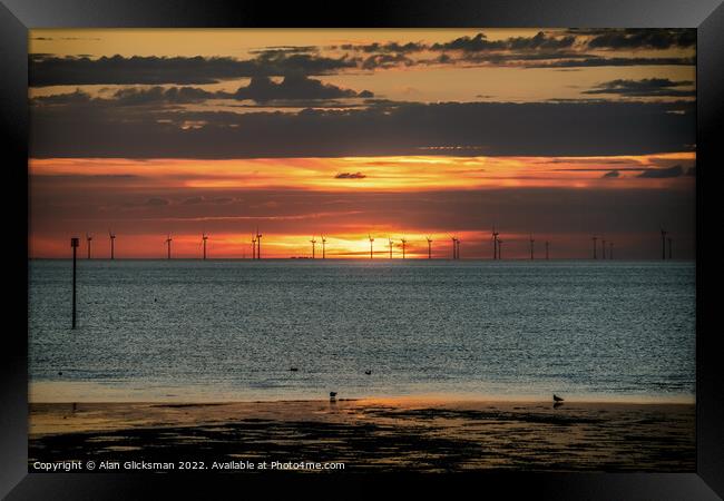 Wind farm at sunset  Framed Print by Alan Glicksman
