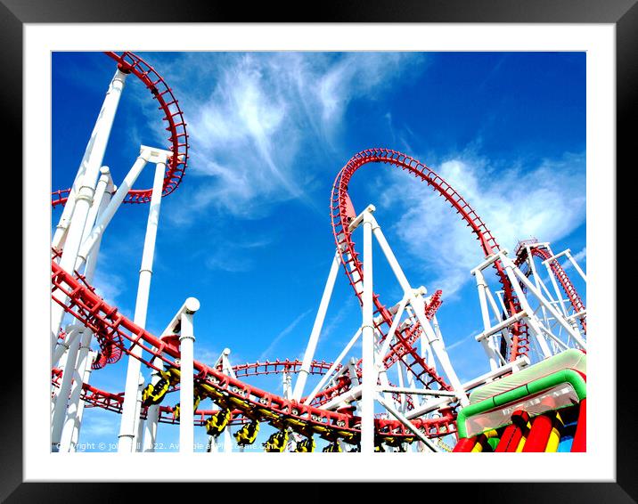 Roller coaster against blue sky. Framed Mounted Print by john hill