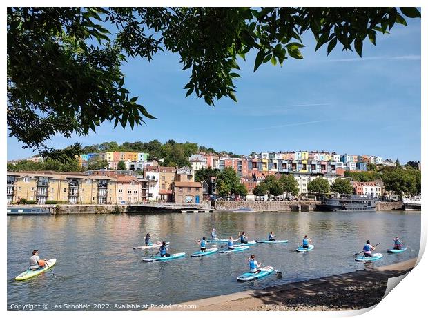 Paddle boards in Bristol harbour  Print by Les Schofield