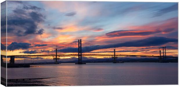 Forth Bridges At Sunset. Canvas Print by Tommy Dickson