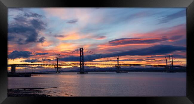 Forth Bridges At Sunset. Framed Print by Tommy Dickson