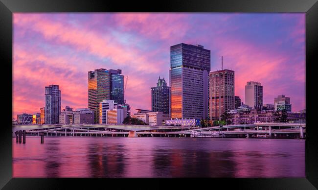 Brisbane City Skyline at Sunset Framed Print by John Frid