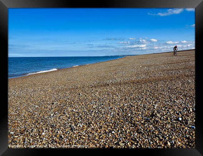 Serene solitude on Norfolk's beach Framed Print by Roger Mechan