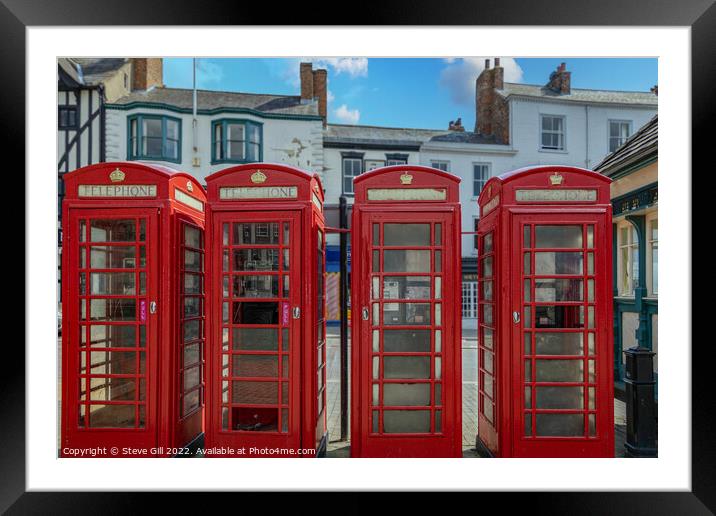 A Row of Four Red Traditional Telephone Boxes. Framed Mounted Print by Steve Gill