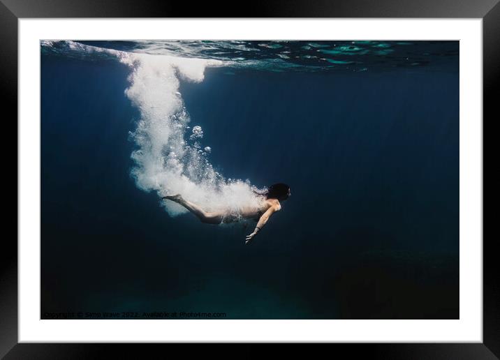 Woman diving underwater Framed Mounted Print by Simo Wave