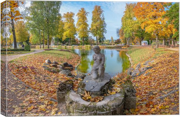 Autumn park landscape with small lake and female statue.  Canvas Print by Maria Vonotna