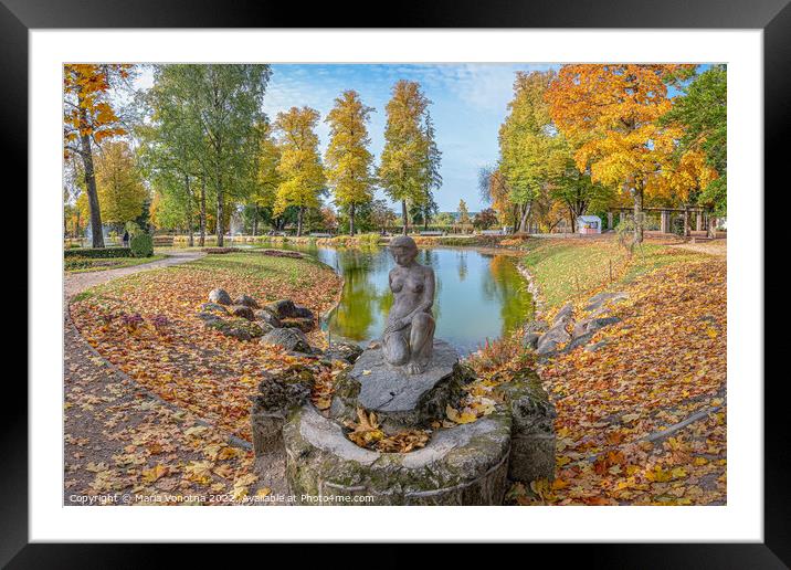 Autumn park landscape with small lake and female statue.  Framed Mounted Print by Maria Vonotna