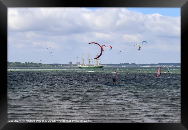 Lots of kite surfing activity at the Baltic Sea beach of Laboe Framed Print by Michael Piepgras