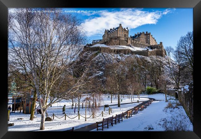 Edinburgh Castle snow from Princes Street Gardens Framed Print by Angus McComiskey