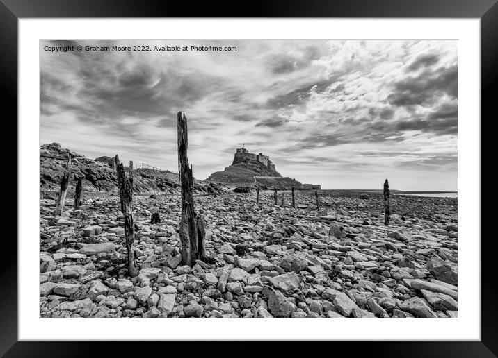 lindisfarne castle from the rocky shore monochrome Framed Mounted Print by Graham Moore