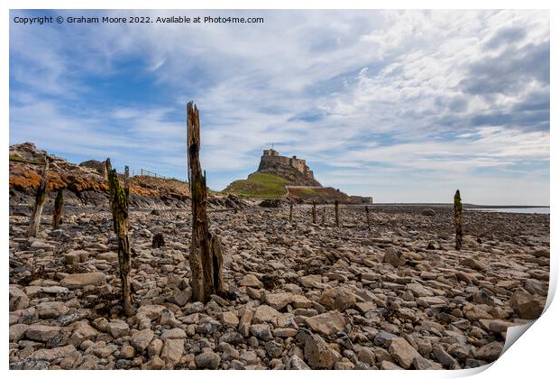 lindisfarne castle from the rocky shore Print by Graham Moore