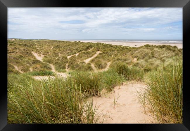 Trails over the dunes by  Ainsdale beach Framed Print by Jason Wells
