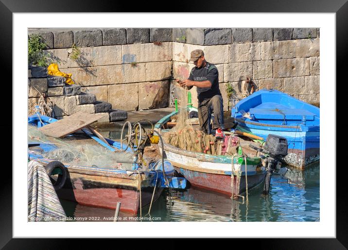 Fisherman in the dock - Siracusa Framed Mounted Print by Laszlo Konya