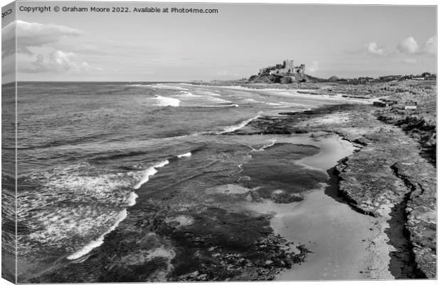 Bamburgh Castle from Harkness Rocks elevated monochrome Canvas Print by Graham Moore