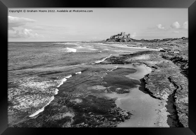 Bamburgh Castle from Harkness Rocks elevated monochrome Framed Print by Graham Moore