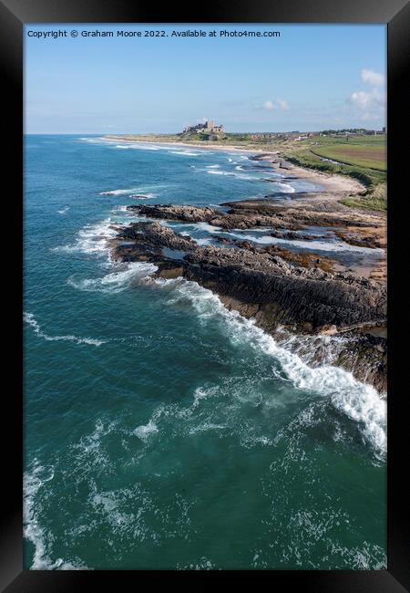 Bamburgh Castle from Harkness Rocks elevated Framed Print by Graham Moore