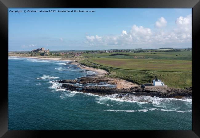 Bamburgh Castle and village from Harkness Rocks Framed Print by Graham Moore