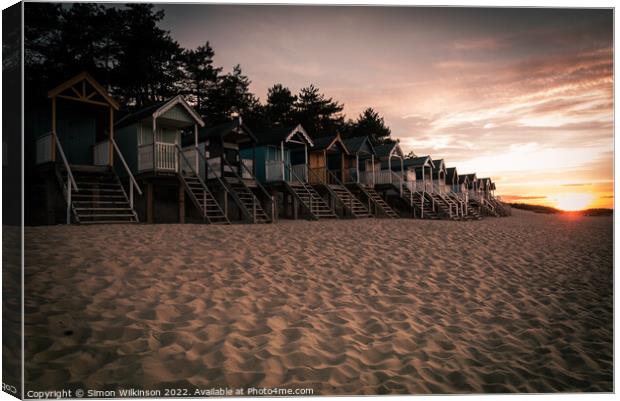 Beach Huts at sunset Canvas Print by Simon Wilkinson