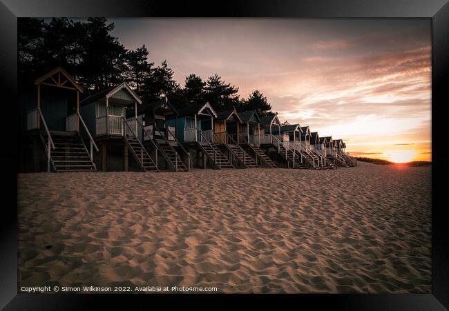 Beach Huts at sunset Framed Print by Simon Wilkinson