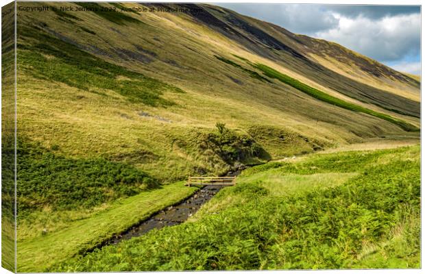 Looking up Barbondale with wooden footbridge over Barkin Beck  Canvas Print by Nick Jenkins