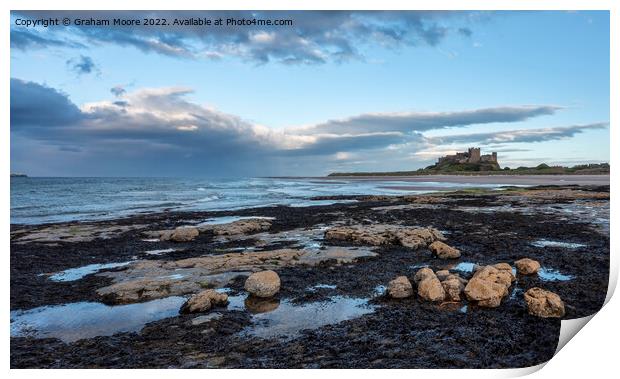 Bamburgh Castle from Harkness Rocks dusk Print by Graham Moore