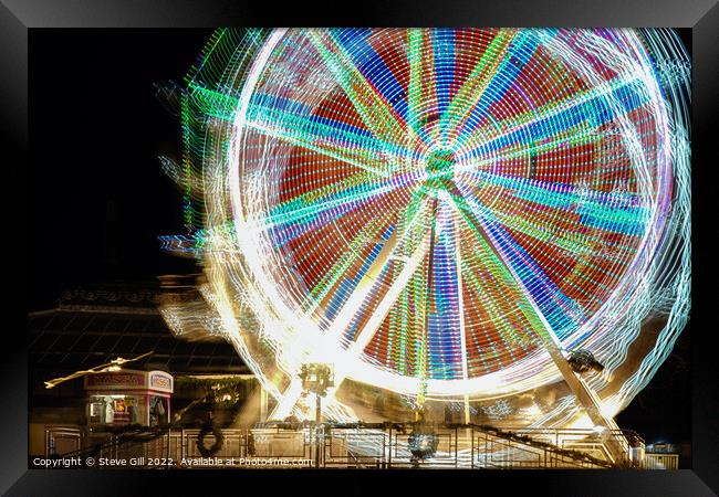 Ferris Wheel with Rotating kaleidoscopic Patterns. Framed Print by Steve Gill