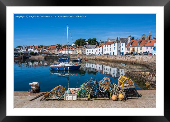 Lobster pots on quayside at St Monans harbour Framed Mounted Print by Angus McComiskey