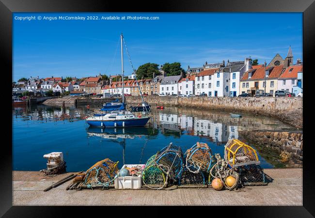 Lobster pots on quayside at St Monans harbour Framed Print by Angus McComiskey